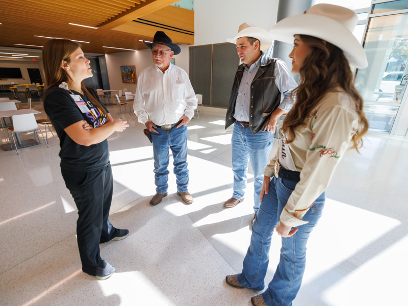 From left, child life manager Cara Williams welcomes James Rasberry, Mississippi State Equine Association president; Mississippi Commissioner of Agriculture and Commerce Andy Gipson; and Josi Johnson, queen of the Mid-South Little Britches Rodeo Association.